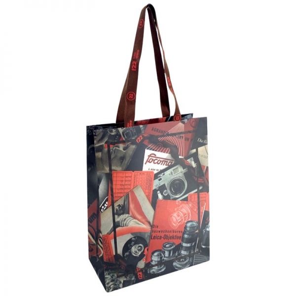 Paper shopping bags with woven tape handles