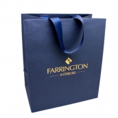 Farrington Interiors paper bag with hot stamping embossed logo and shiny blue handles
