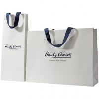 Elegant shopping bag with matt lamination and blue handles