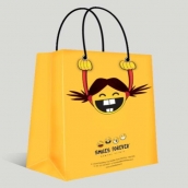 Yellow shopping bag with funny pattern design and silver metal eyelets