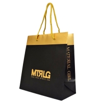 Shiny gold and black colour paper shopping bag with glossy gold string handles