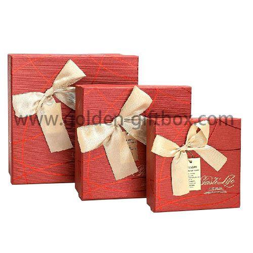 Classic red paper gift box with ribbon